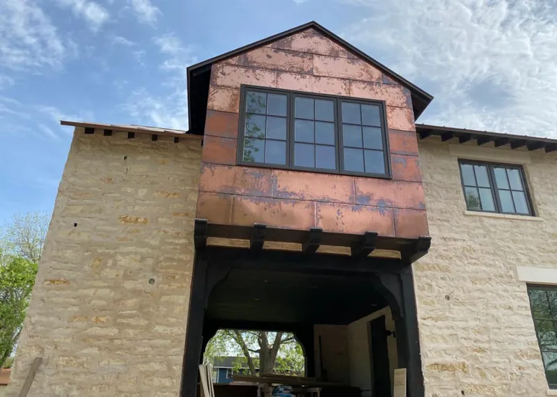 Copper metal panel facade on a stone building for Metal Roof Coating in Lake Stickney