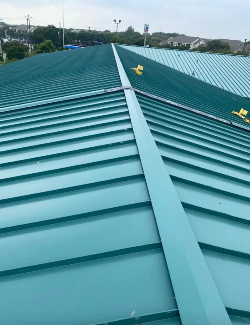 Green commercial metal roof ridge and valley for Metal Roof Repair in Lake Stickney